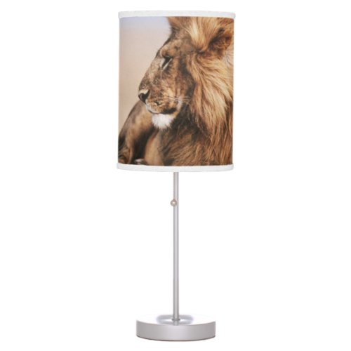 Lion resting in grass table lamp