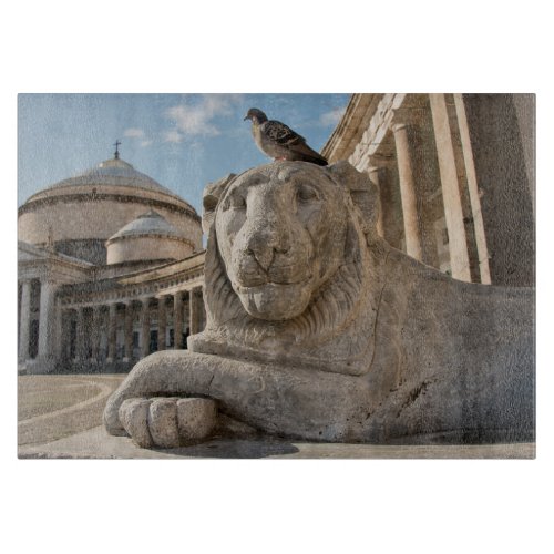 Lion statue in front of historic church cutting board