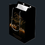 Lit Menorah Elegant Black & Gold Happy Hanukkah Medium Gift Bag<br><div class="desc">This beautiful black and gold gift bag features an artistic photograph of a lit menorah shot from below giving it a very dramatic look. The text is an elegant lacy script reading Happy Hanukkah. Wonderful way to send holiday cheer.</div>