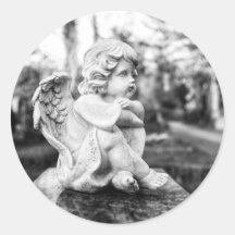 Little angel sitting watching the horizon