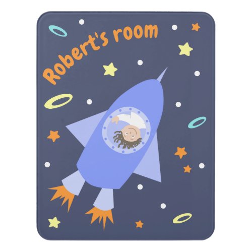 Little astronaut on rocket door sign