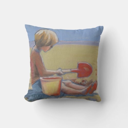 Little boy playing in the sand with a shovel throw pillow