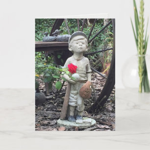 little boy with baseball statue and red rose card