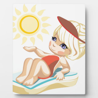 Little girl sunbathing on the beach plaque