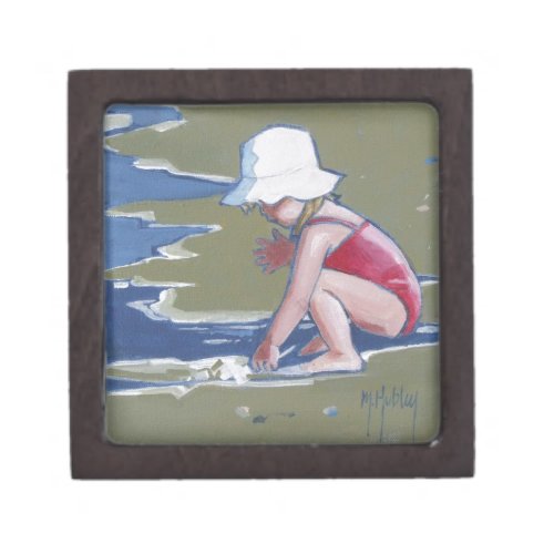 Little girl with hat on beach with waves jewelry box