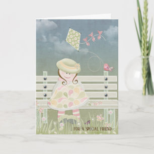 little girl with kite on bench for friendship card