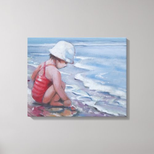 Little girl with white hat at the beach canvas print