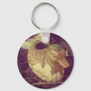 Little Glass Pie Duck Sitting in a Garden Keychain