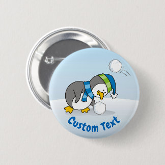 Little penguin getting a snow ball button