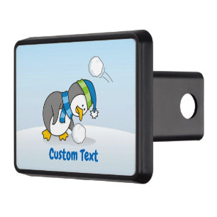 Little penguin getting a snow ball hitch cover