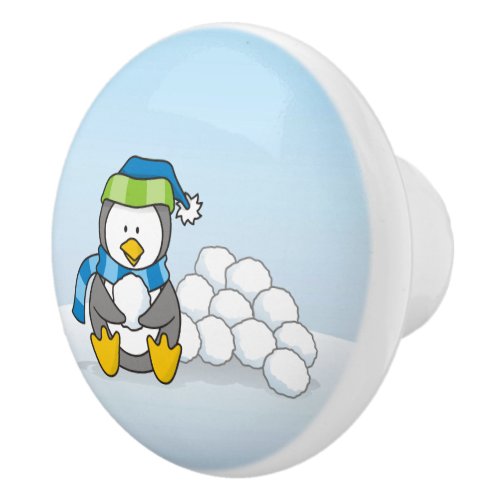 Little penguin sitting with snowballs ceramic knob