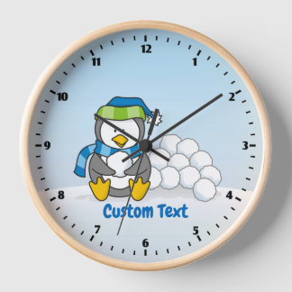 Little penguin sitting with snowballs clock