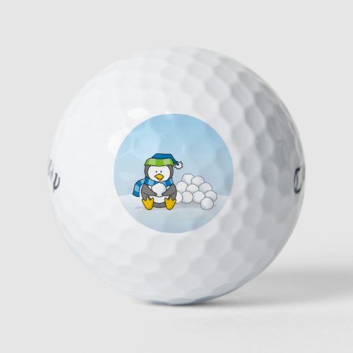 Little penguin sitting with snowballs golf balls