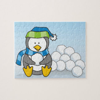 Little penguin sitting with snowballs jigsaw puzzle