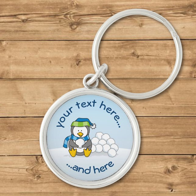 Little penguin sitting with snowballs keychain (Creator Uploaded)
