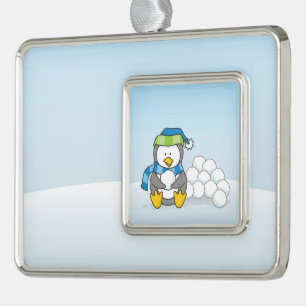 Little penguin sitting with snowballs ornament
