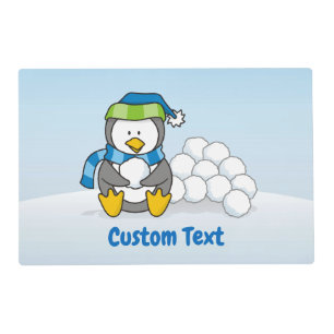 Little penguin sitting with snowballs placemat