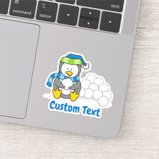 Little penguin sitting with snowballs sticker