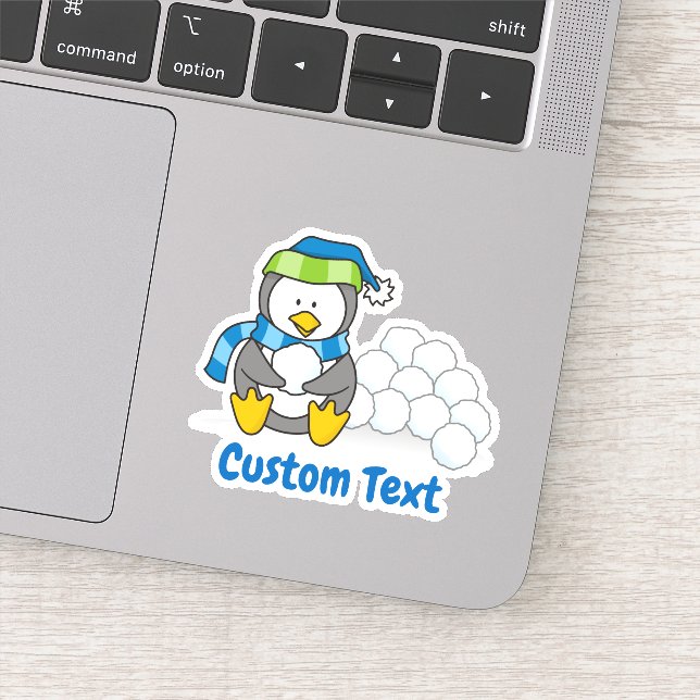Little penguin sitting with snowballs sticker (Detail)