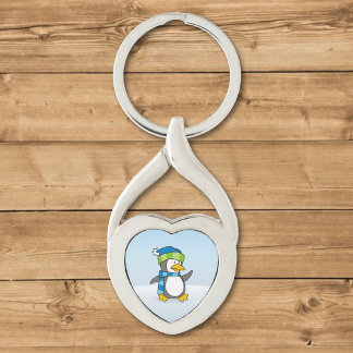 Little penguin walking on snow keychain