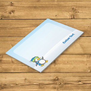Little penguin walking on snow notepad