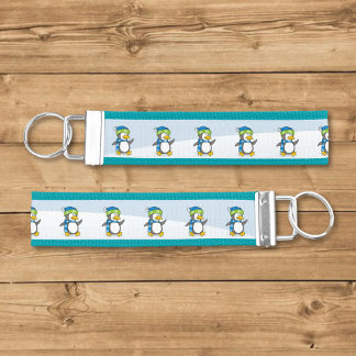 Little penguin walking on snow wrist keychain