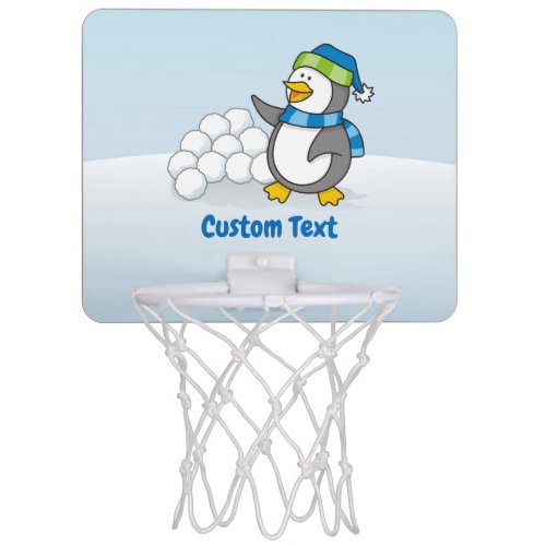 Little penguin with snow balls waving mini basketball hoop