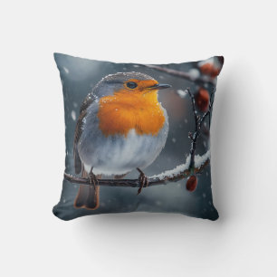 Little robin bird sitting on a branch at winter throw pillow