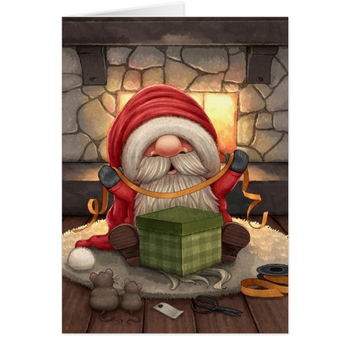 Little Santa wrapping a gift