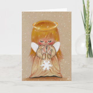 Little winter angel in snow christmas card