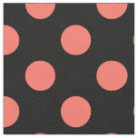 Living coral polka dots on black fabric
