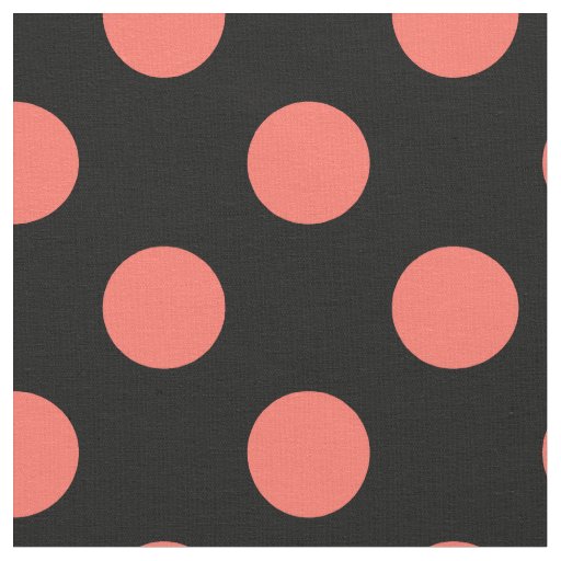 Living coral polka dots on black fabric