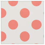 Living coral polka dots on white fabric