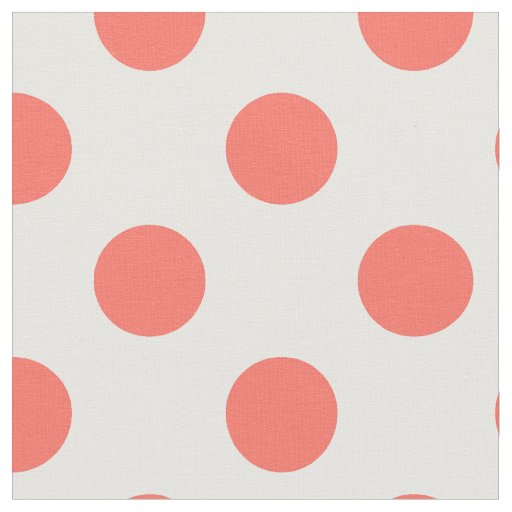 Living coral polka dots on white fabric
