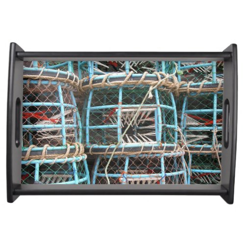 Lobster pots stacked on the harbor serving tray