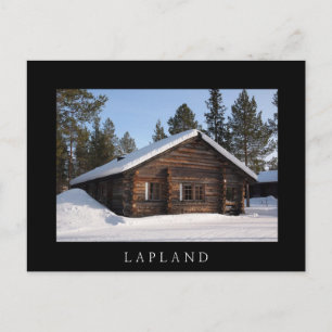 Log cabin in the snow, Lapland black text postcard