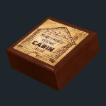 Log Cabin Personalized Faux Wood Jewelry Box<br><div class="desc">This rustic, custom cabin design has a swirled, faux wood look that gets lighter in the middle. Inside the old-fashioned cabin drawing - derived from a vintage, early 1900's advertisement - you can add your name. The word "CABIN" can also be changed to "HOME" or another short word. The design...</div>