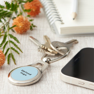 Logo With Light Blue Background on Oval Metal Keychain