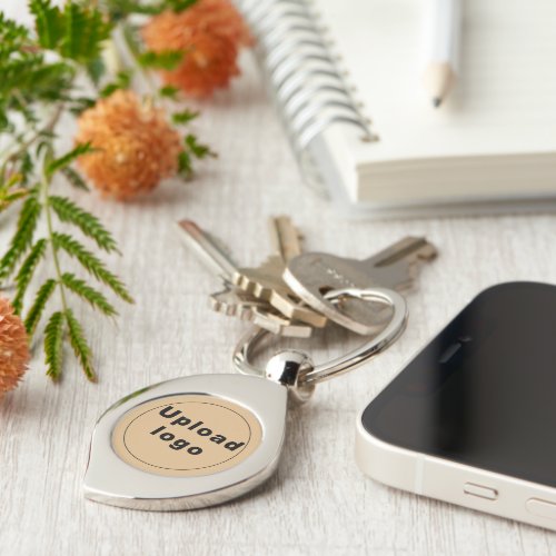 Logo With Light Brown Background on Swirl Metal Keychain