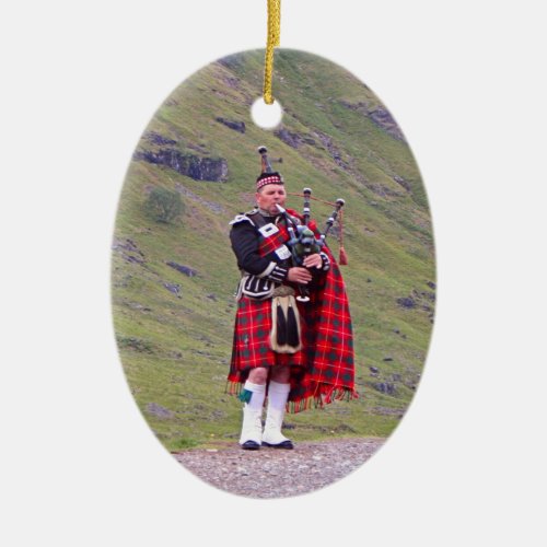 Lone Scottish bagpiper Highlands Scotland Ceramic Ornament