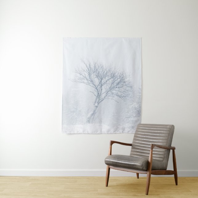 Lonely tree during snow storm in winter tapestry (In Situ)