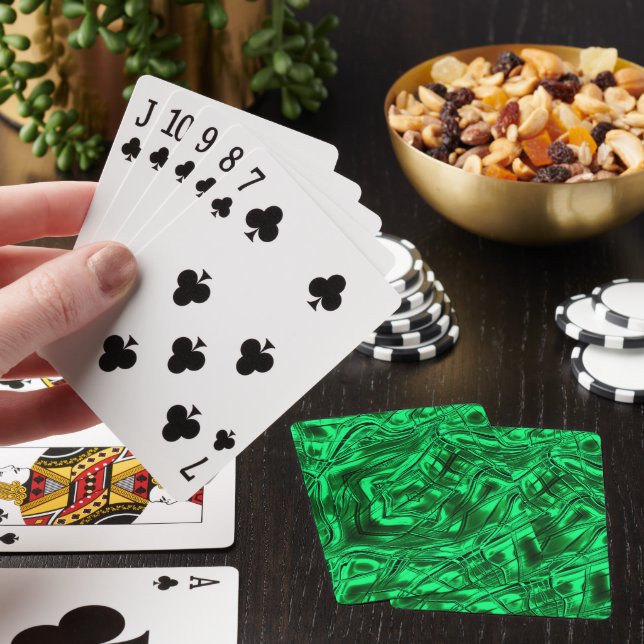 Long curved strokes forming star on green metallic poker cards (In Situ)