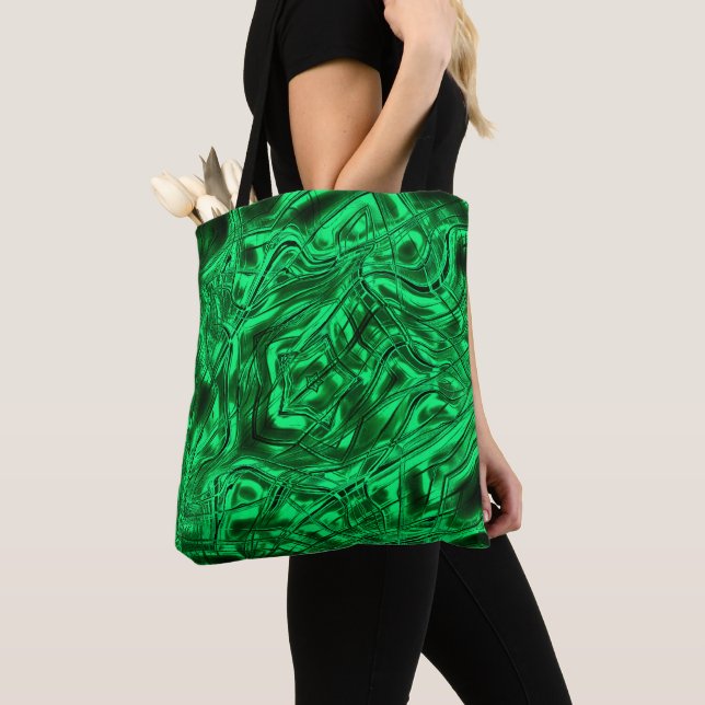 Long curved strokes forming star on green metallic tote bag (Close Up)
