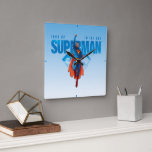 Look Up It’s Superman Square Wall Clock<br><div class="desc">Soar into classic comic book action with this electrifying Superman artwork! Featuring the Man of Steel flying skyward in a powerful pose, this vibrant design channels vintage comic book vibes with a modern edge. His red cape billows behind him as he punches through the sky, framed by bold blue lettering...</div>