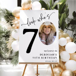 Look Who's 70! Modern Photo 70th Birthday Foam Board<br><div class="desc">Celebrate the magnificence of turning 70 with these 'Look who's 70' Party Foam Boards. Adorned with a sophisticated italic serif font and an elegant calligraphy script set on a minimalist white backdrop, these signs are the star of the show. Showcasing a photo of the birthday celebrant in the zero position,...</div>