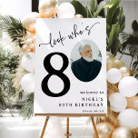 Look Who's 80! Modern Photo 80th Birthday Foam Board<br><div class="desc">Celebrate the magnificence of turning 80 with these 'Look who's 80' Party Foam Boards. Adorned with a sophisticated italic serif font and an elegant calligraphy script set on a minimalist white backdrop, these signs are the star of the show. Showcasing a photo of the birthday celebrant in the zero position,...</div>