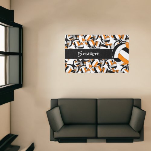 Lots of orange black volleyballs sports room decor rug