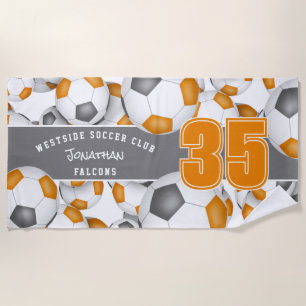 Lots of soccer balls orange gray team colors beach towel