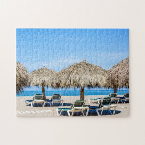 Lounge Chairs And Thatch Umbrellas On Beach Jigsaw Puzzle