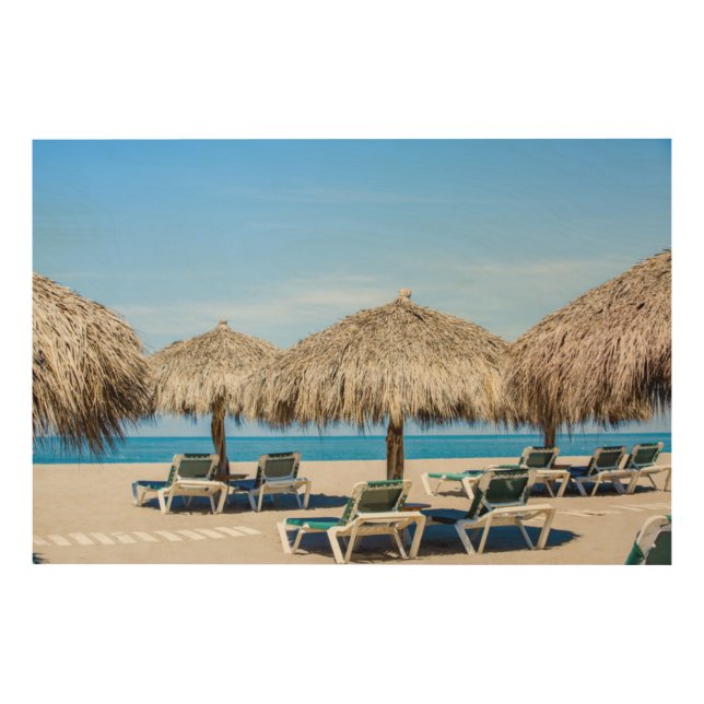 Lounge Chairs And Thatch Umbrellas On Beach Wood Wall Art (Front)